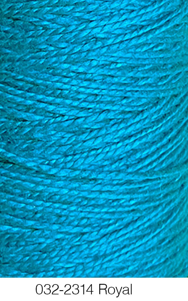 Close-up of vibrant blue Circulo 10/2 Looma Mercerized Pearl Cotton Yarn wound tightly in diagonal layers on a large cone; the bottom label reads 032-2314 Royal. This Oeko-Tex certified yarn ensures quality and safety for your creative projects.