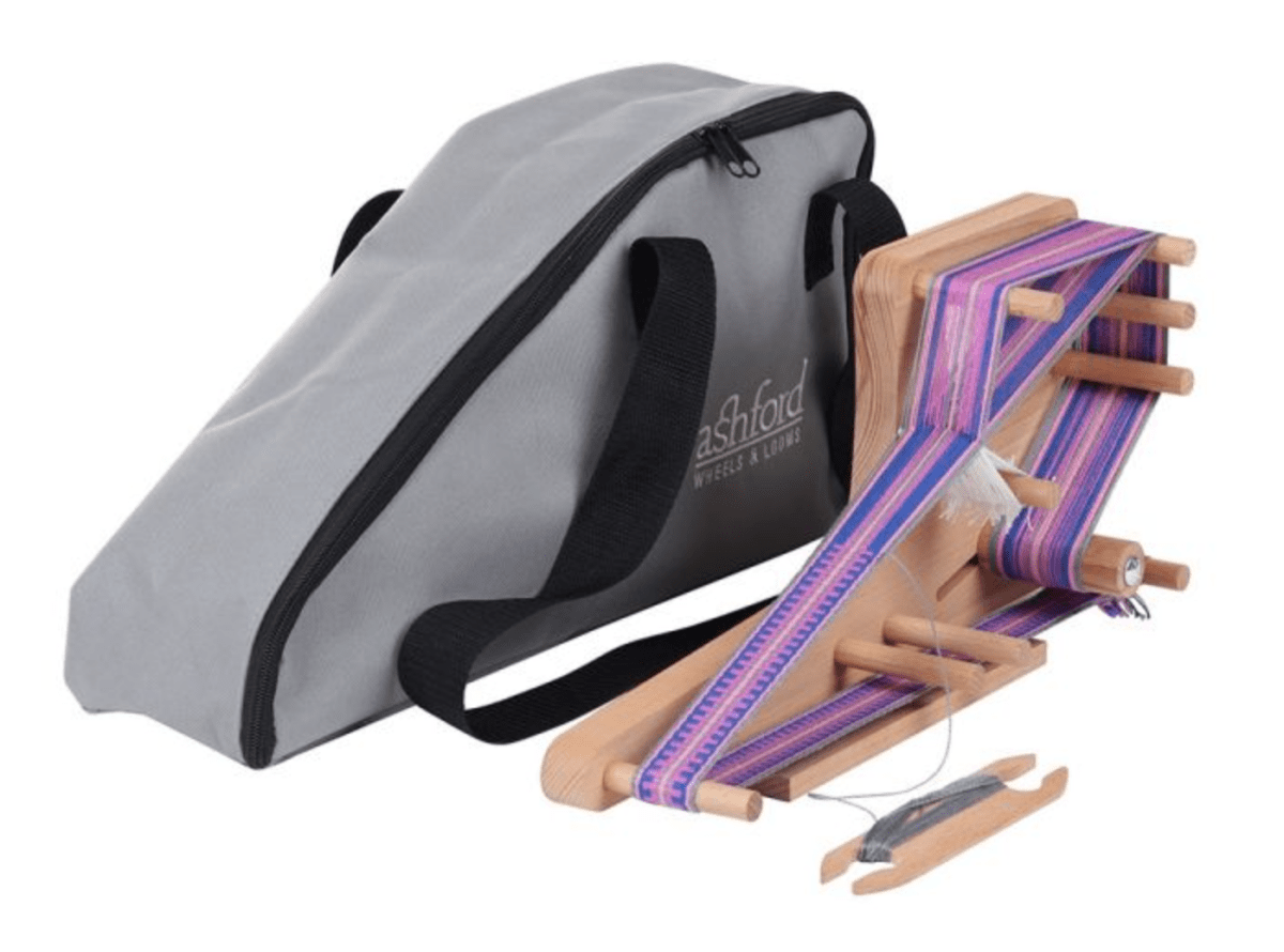 The Ashford Inklette Loom Carrying Bag by Ashford Handicrafts Limited is a gray bag with black handles and a zipper, ideal for carrying your loom, yarn, and shuttle for portable weaving projects.