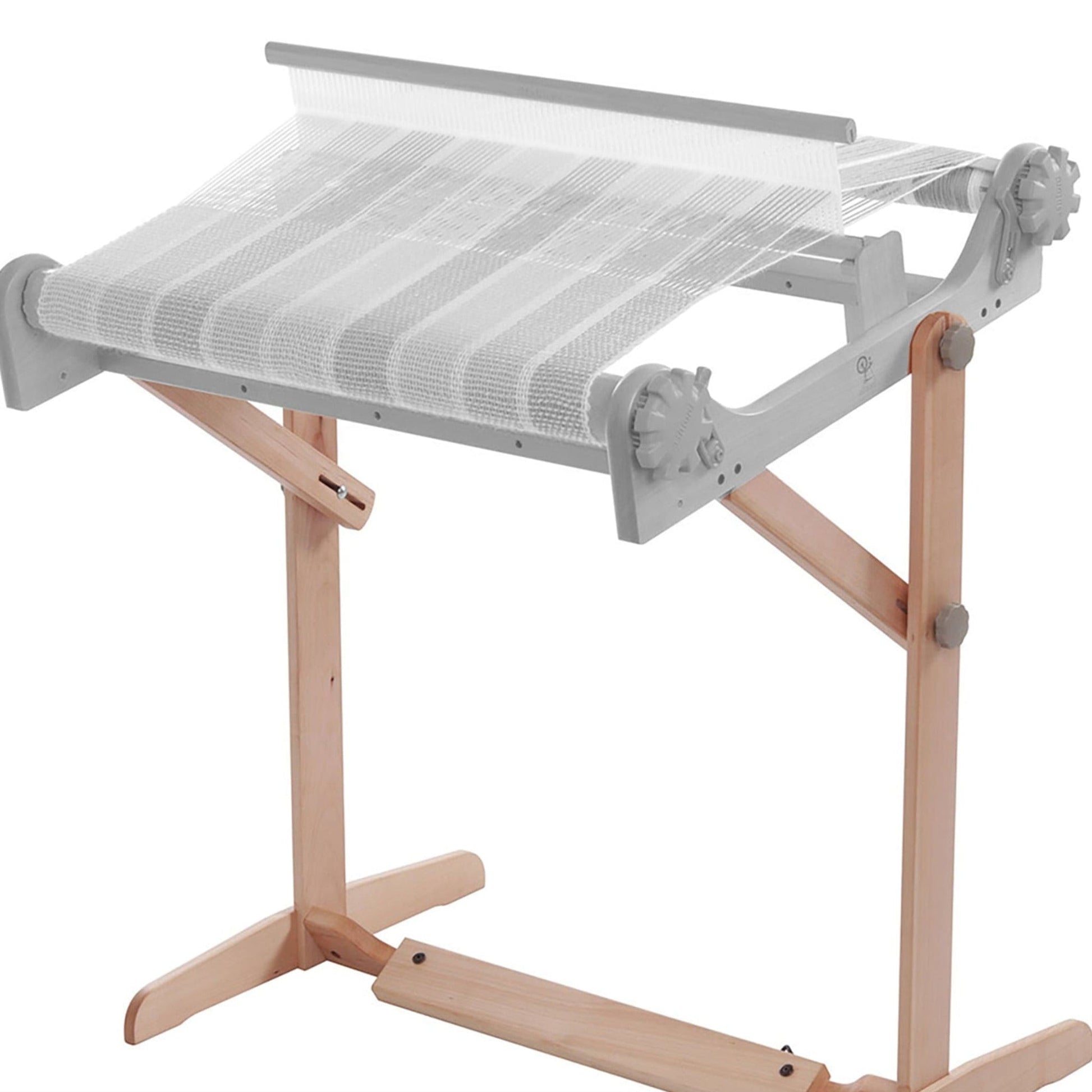The Ashford Rigid Heddle Floor Stand by Ashford Handicrafts Limited is an ergonomic weaving stand with an adjustable weaving angle, designed to support a tabletop loom for comfortable crafting.