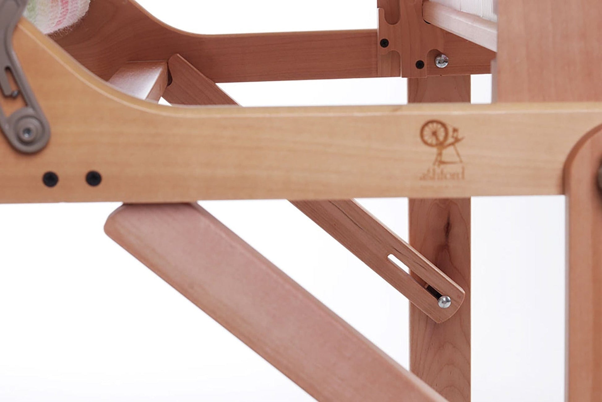 Close-up of the Ashford Rigid Heddle Floor Stand by Ashford Handicrafts Limited, featuring ergonomic adjustable joints, durable metal hardware, and an engraved logo on wood. The plain white background highlights its adjustable weaving angle.