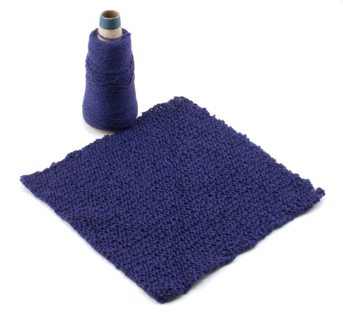 A Casco Bay Washcloths download by Halcyon Yarn is shown next to a square swatch of knitted purple fabric, ideal for washcloth projects, on a white background.
