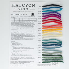 The Classic Rug Wool Sample Card from Halcyon Yarn features 13 numbered strands in vibrant colors like red, blue, and green. Perfect for rug makers, it provides product details and contact info.