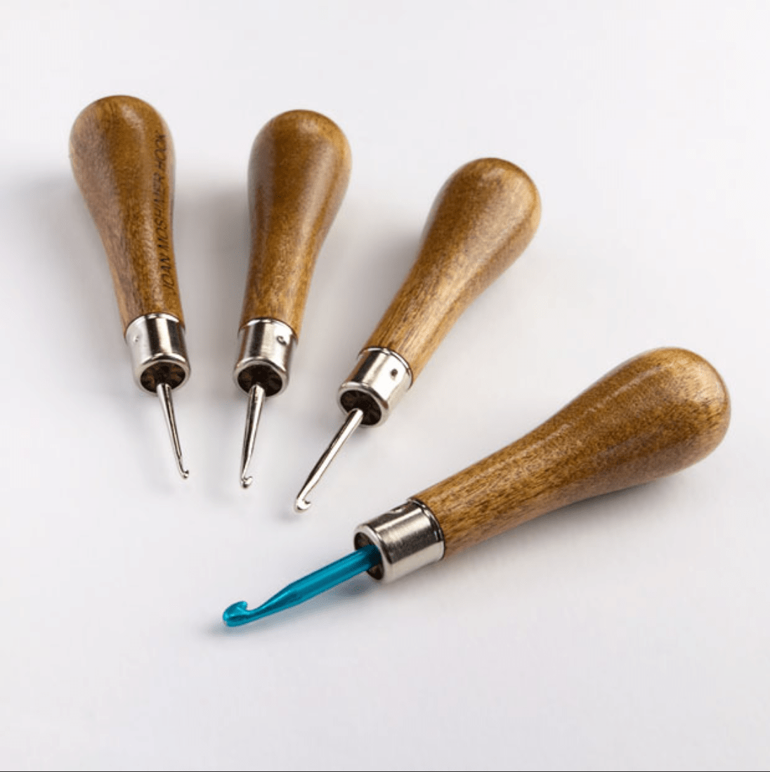 Four Moshimer Rug Hooks with hardwood maple handles and metal tips, including one with a blue hook.