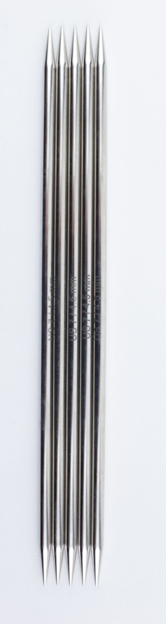 Six Knit Pro Nova Metal Double-Point Knitting Needles (6 inch) by Accessories Unlimited are arranged side by side on a white background, with their chrome-plated tips alternating at the top and bottom.