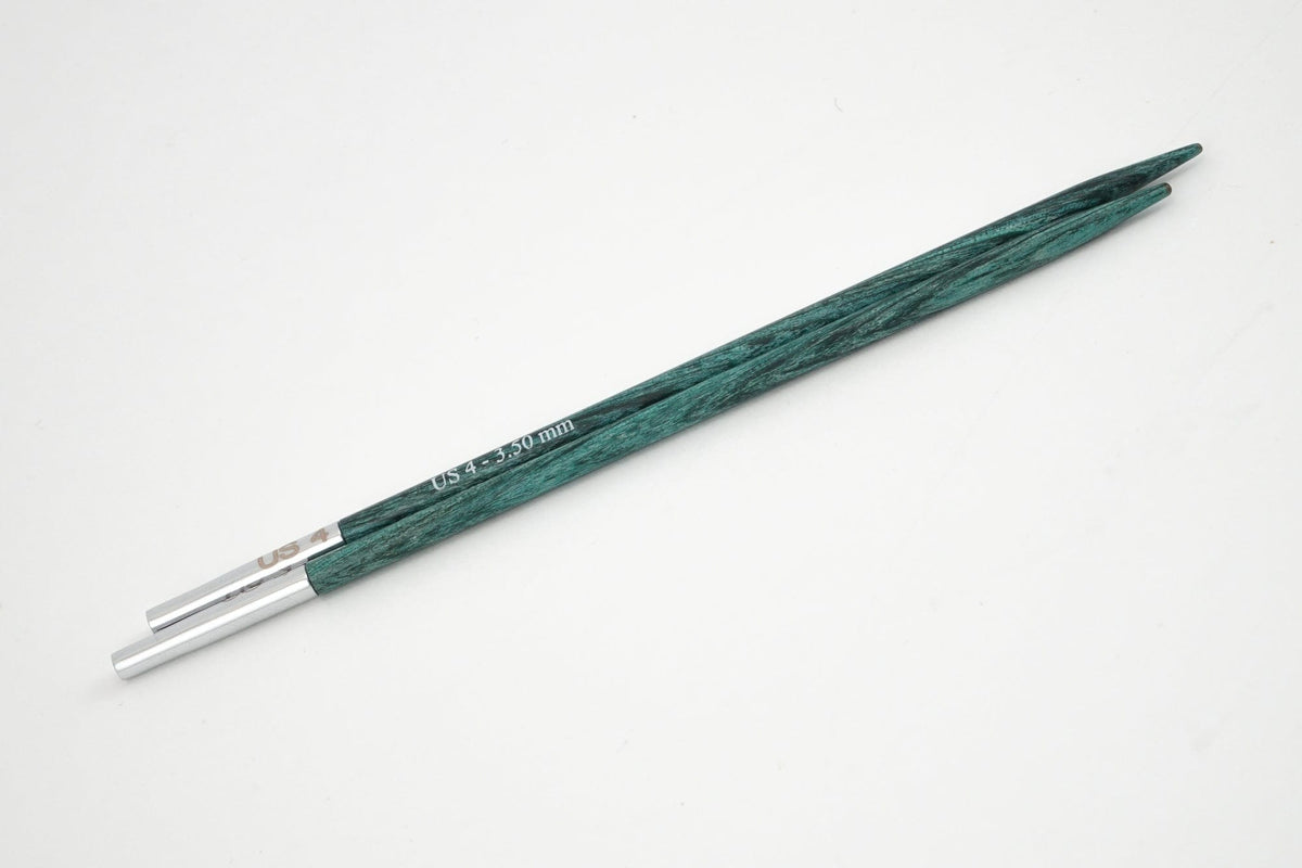 A pair of Accessories Unlimited Knit Pro (Knitters Pride) Dreamz Interchangeable Knitting Needle Tips in green laminated birch with silver tips, displayed parallel on a white background.