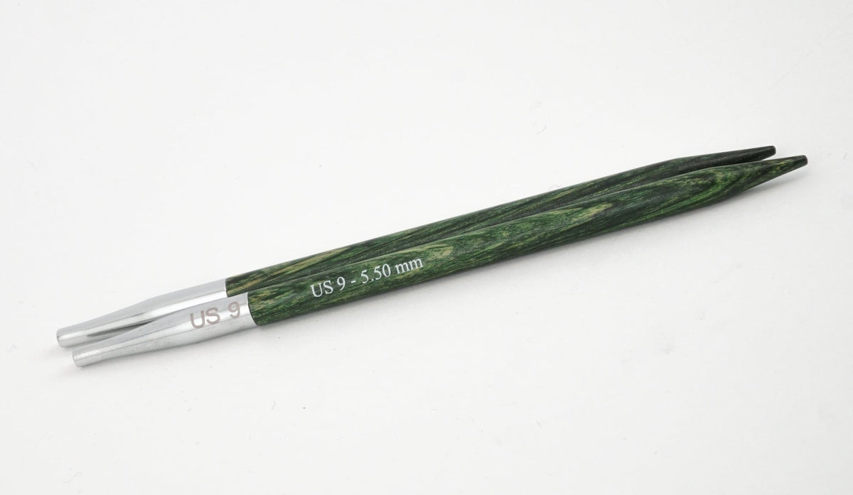 A pair of Knit Pro Dreamz Interchangeable Needle Tips (US 9 - 3.50 mm) by Accessories Unlimited, in green and silver laminated birch, are shown side by side on a white background.