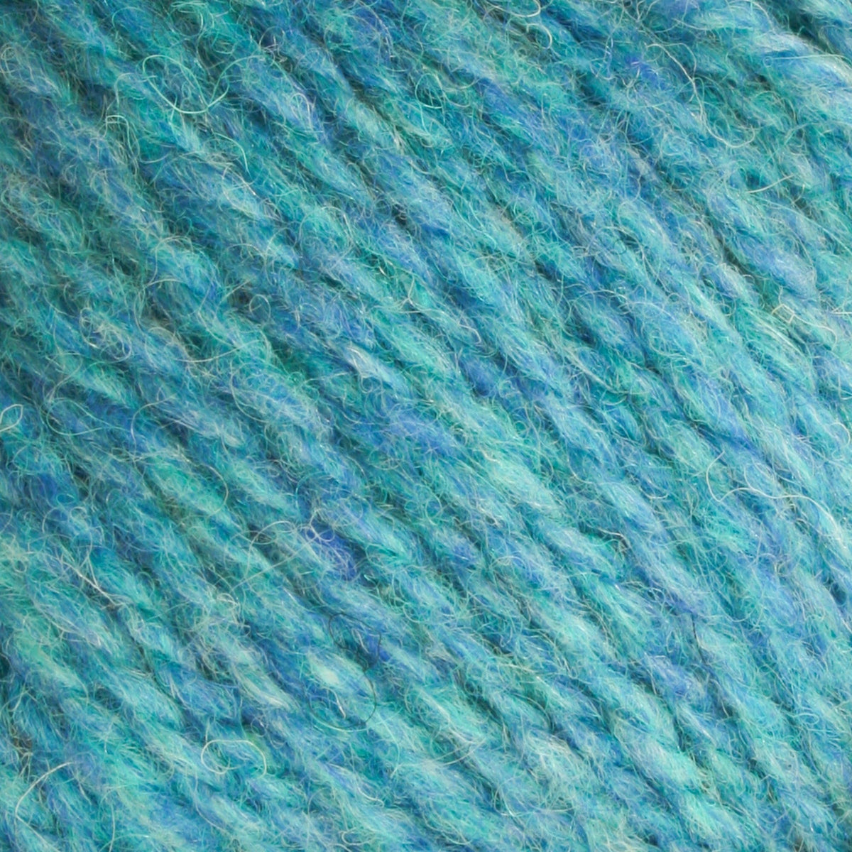 Close-up of Bartlettyarns Maine Wool Yarn (Fisherman 2-Ply) fibers in blue and teal, twisted together to reveal a soft, textured surface with a mix of light and dark shades.