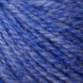 Close-up of Bartlettyarns' Bartlett Maine Wool, Sport Weight Cones in blue and purple, highlighting its soft texture and twisted strands. The subtle gradient of colors creates a cozy, homespun effect.