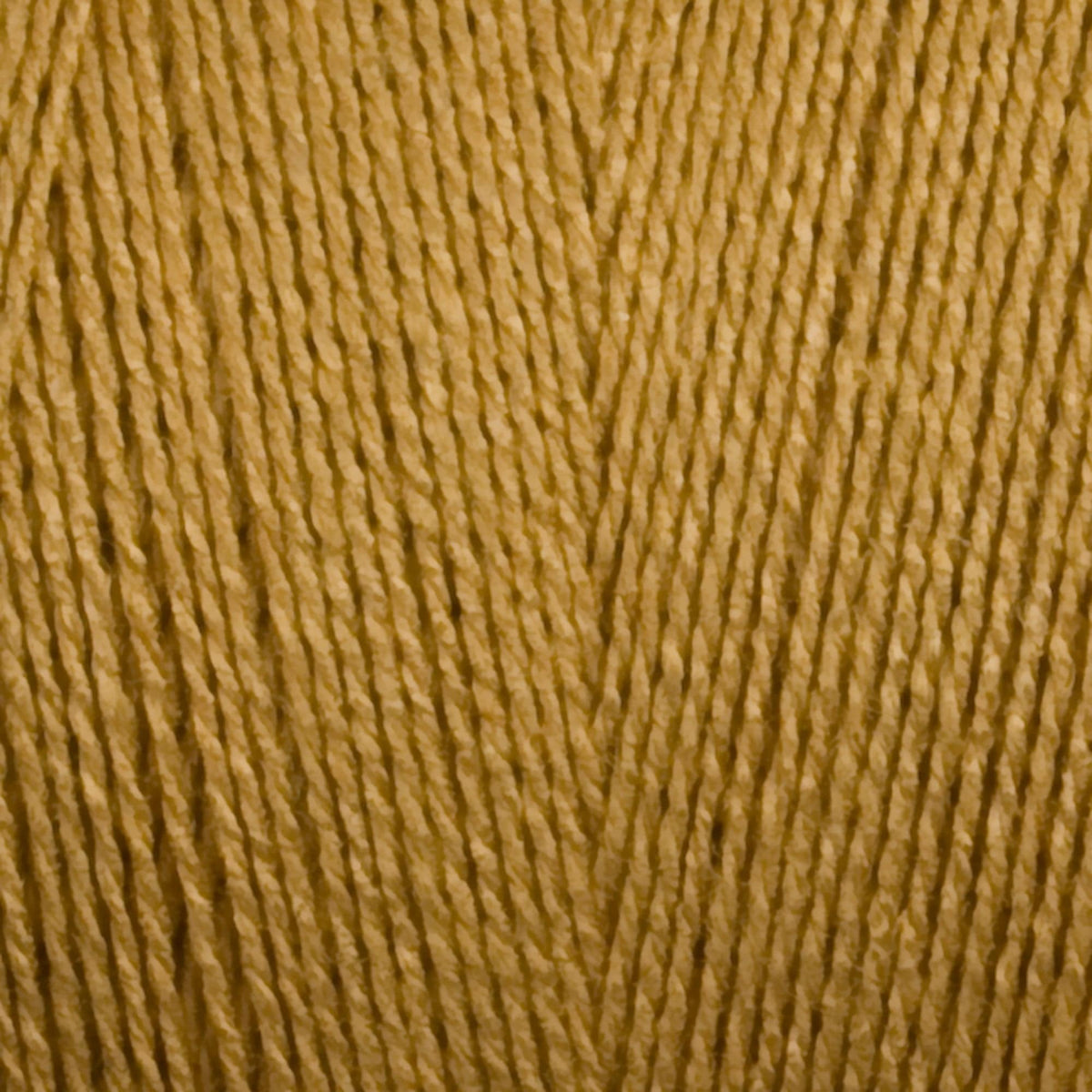 Close-up of Maurice Brassard 8/2 Tencel Yarn | Mini-cone in golden-yellow, highlighting its fine texture and V-shaped fiber pattern—ideal for delicate weaving projects.