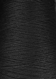 Close-up image of tightly wound black 3/2 Looma Circulo Mercerized Pearl Cotton Yarn on a Mini Cone, showcasing the fine texture and layered fibers. This Oeko-Tex certified yarn by Circulo emphasizes quality and sustainability for textile crafting projects.