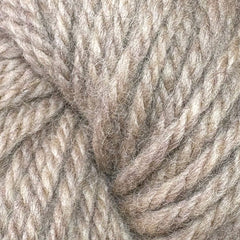Close-up of Halcyon Yarn Classic Rug Wool | Strand by Caledonian Dye Works, showcasing thick, twisted beige and light brown fibers with a soft, fuzzy texture—perfect for rug weaving.