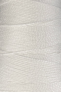 Close-up of tightly wound white 10/2 Looma Circulo Mercerized Pearl Cotton Yarn | Mini Cone by Circulo, showing the individual fibers and detailed texture.