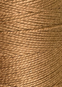 Close-up of tightly wound 3/2 Looma Circulo Mercerized Pearl Cotton Yarn (Mini Cone) by Circulo, highlighting the detailed texture and fibers of the yarn—ideal for weaving and craft projects.