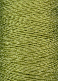 A close-up of a spool of Circulo's 3/2 Looma Mercerized Pearl Cotton Yarn in light green, highlighting the tightly wound, lustrous fibers arranged in a crisscross pattern reminiscent of weaving yarn or pearl cotton.