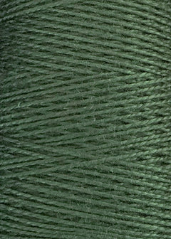 A close-up view of Circulo 5/2 Looma Mercerized Pearl Cotton Yarn (Mini Cone) showcases its green threads wound tightly in parallel rows, creating a textured and slightly shiny surface.
