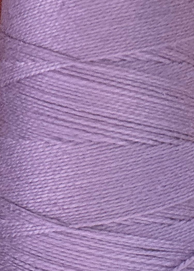 Close-up of a spool of light purple Circulo 10/2 Looma Mercerized Pearl Cotton Yarn | Large Cone, showing the fine details of the threads wound tightly in a diagonal pattern around the spool.