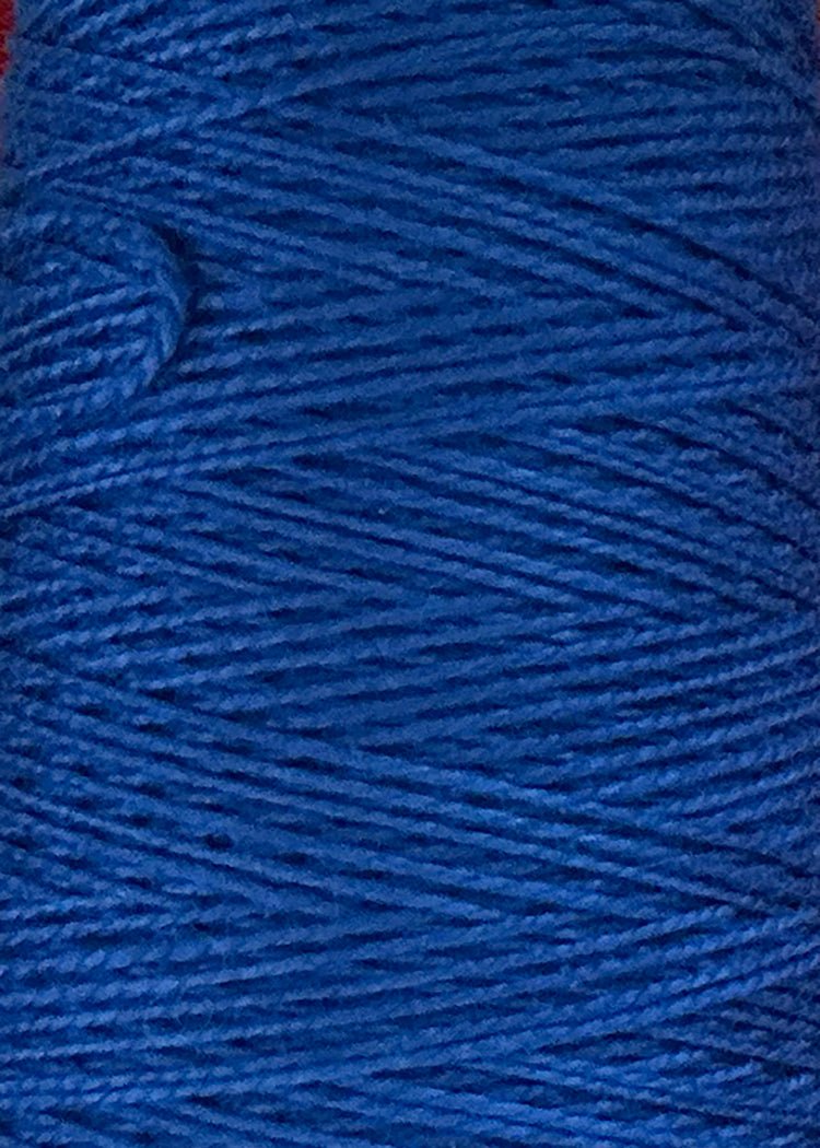 Close-up of a spool of Circulo 10/2 Looma Mercerized Pearl Cotton Yarn | Mini Cone in bright blue, highlighting the texture and tightly wound individual strands.