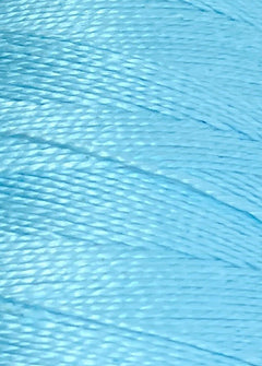 Close-up view of Circulo 5/2 Looma Mercerized Pearl Cotton Yarn in light blue, showcasing the mini cone’s smooth texture, tightly wound fibers, and subtle sheen.