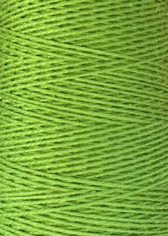 Close-up view of Circulo 5/2 Looma Mercerized Pearl Cotton Yarn in green, wound tightly in parallel rows on a large cone, highlighting the texture and fine fibers of the yarn.