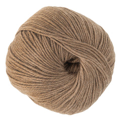 A soft, light brown ball of Cascade 220 Superwash Wool Yarn by Cascade Yarns is neatly wound with the end tucked inside. This easy-care superwash merino is ideal for knitting or crocheting projects.