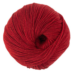 Cascade Yarns' Cascade 220 Superwash Wool Yarn is a DK weight yarn wound tightly in a circular shape, with visible strands and a small hollow center.