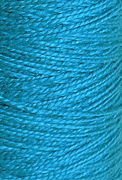 Close-up of tightly wound 3/2 Looma Circulo Mercerized Pearl Cotton Yarn | Mini Cone by Circulo in bright blue, highlighting the texture and individual strands arranged in a diagonal pattern.