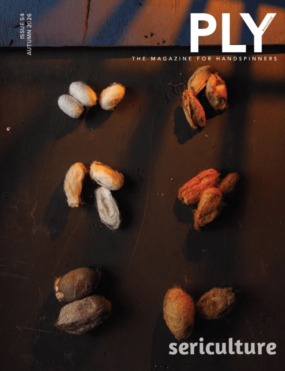 Colorful clusters of silkworm cocoons rest on a dark wooden surface, illuminated by warm light, on the cover of PLY Magazine’s Issue 54, Autumn 2026: Sericulture. The magazine title is prominently displayed, with “sericulture” at the bottom—hinting at in-depth content for handspinners eager to explore silk fiber and silk spinning from PLY - The Magazine for Handspinners.