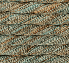 Close-up of Malabrigo Torzal hand-dyed, variegated sport weight yarn in shades of sage green, brown, and cream, twisted into multiple parallel strands.