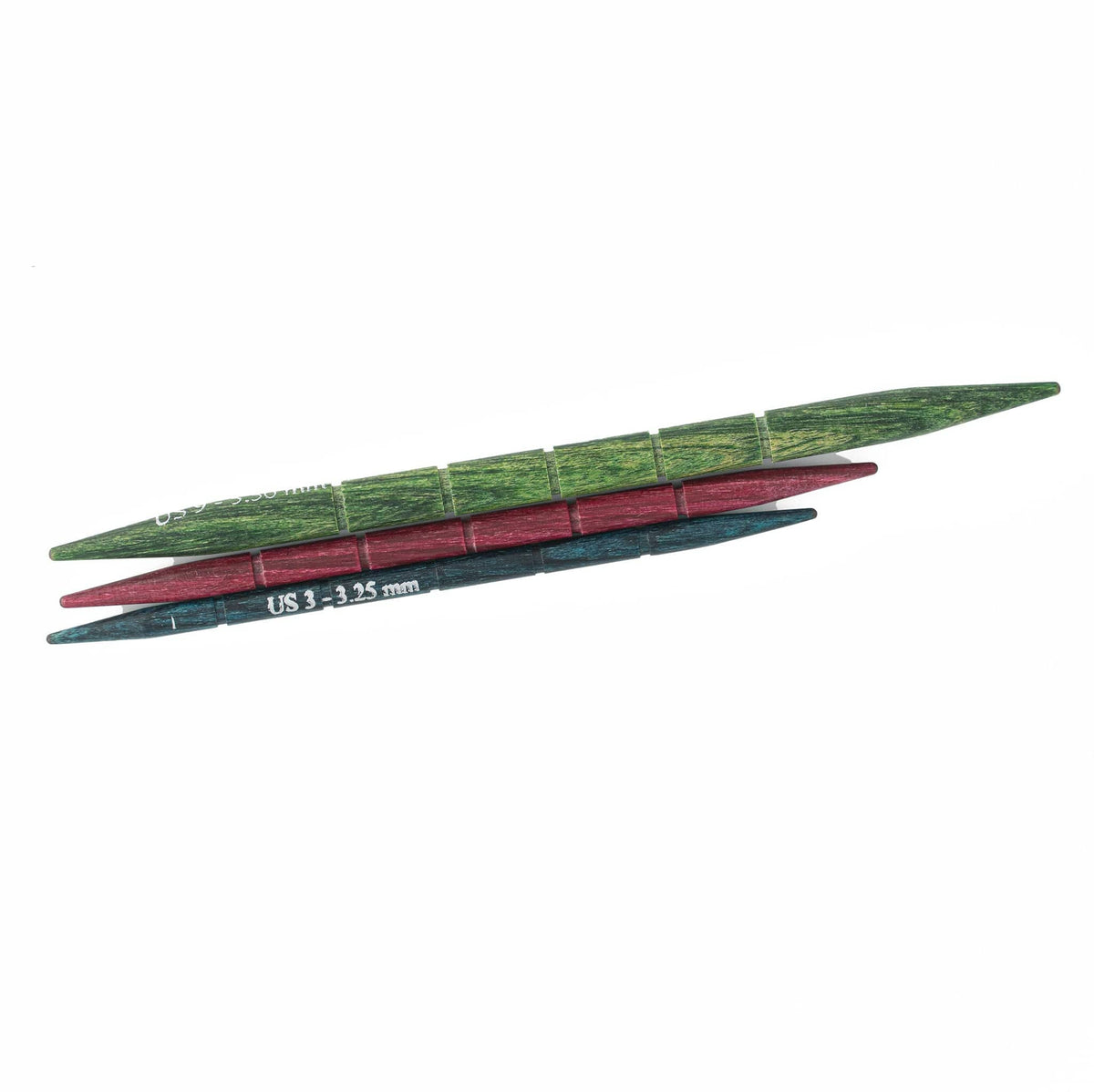Accessories Unlimited Knit Pro Dreamz Cable Needles include three laminated birch needles with grooved, interchangeable wooden tips in green, red, and blue. The blue needle is marked US 3 (3.25 mm) in white text.