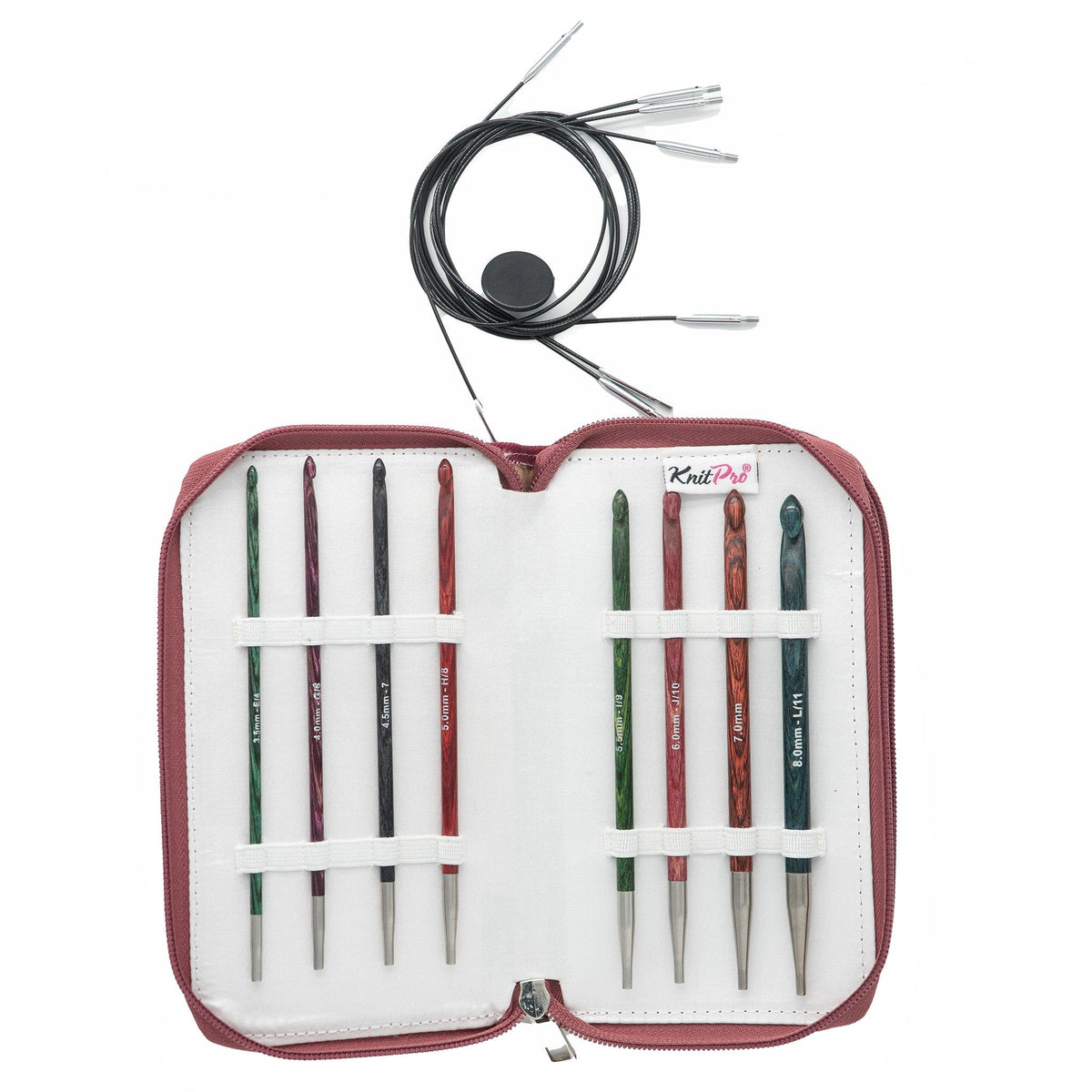 The Accessories Unlimited Knit Pro Dreamz Tunisian Crochet Hook Set features eight multicolored hooks in a zippered maroon case, plus a black circular knitting cable and interchangeable Tunisian crochet hooks arranged above the case.
