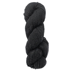 A skein of Bartlettyarns Maine Wool Yarn (Fisherman 2-Ply) by Bartlettyarns in black, worsted weight, is tightly twisted into a thick coil and displayed against a white background.
