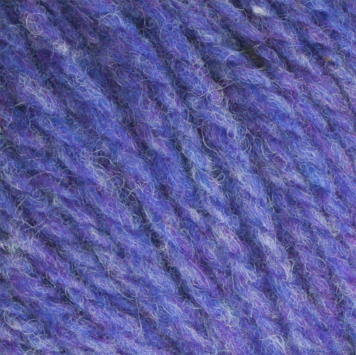 Close-up of Bartlettyarns Maine Wool Yarn (Fisherman 2-Ply) by Bartlettyarns in purple and blue variegated worsted weight, highlighting its soft texture and intertwined fibers ideal for knitting or crocheting.