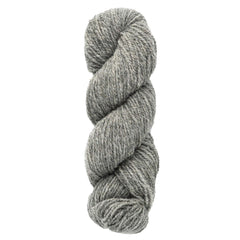 A skein of Bartlettyarns Maine Wool Yarn (Fisherman 2-Ply) is twisted into a neat coil, highlighting its soft, textured fibers and classic worsted weight feel.