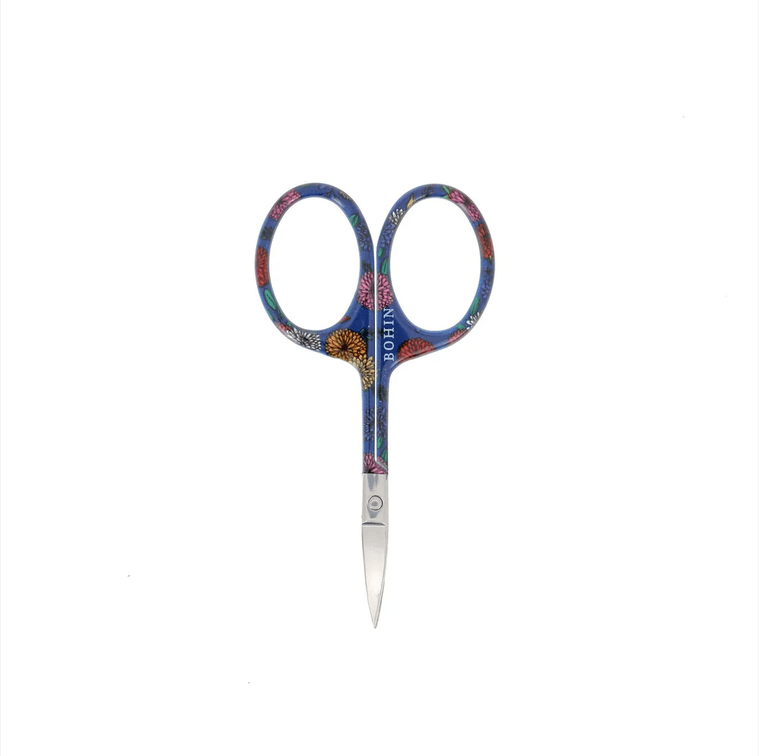 A pair of Bryson Distributing, Inc. Small Floral Scissors, 4" (flat tip), featuring blue handles with a vibrant floral design, stands upright against a white background.