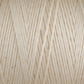 Close-up of cream-colored Cotton Carpet Warp 8/4 showing tightly wound, interwoven threads with a soft, slightly fuzzy texture. Tiny specks are visible on the smooth background, suggesting its potential for colorfast rag rugs.