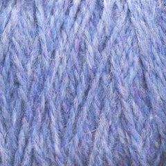 Close-up view of soft blue and purple multicolored Harrisville Shetland Yarn - Unwashed Cones by Harrisville Designs, showing woven strands with fine texture and delicate fibers—ideal for Fair Isle knitting or crafting lightweight blankets.