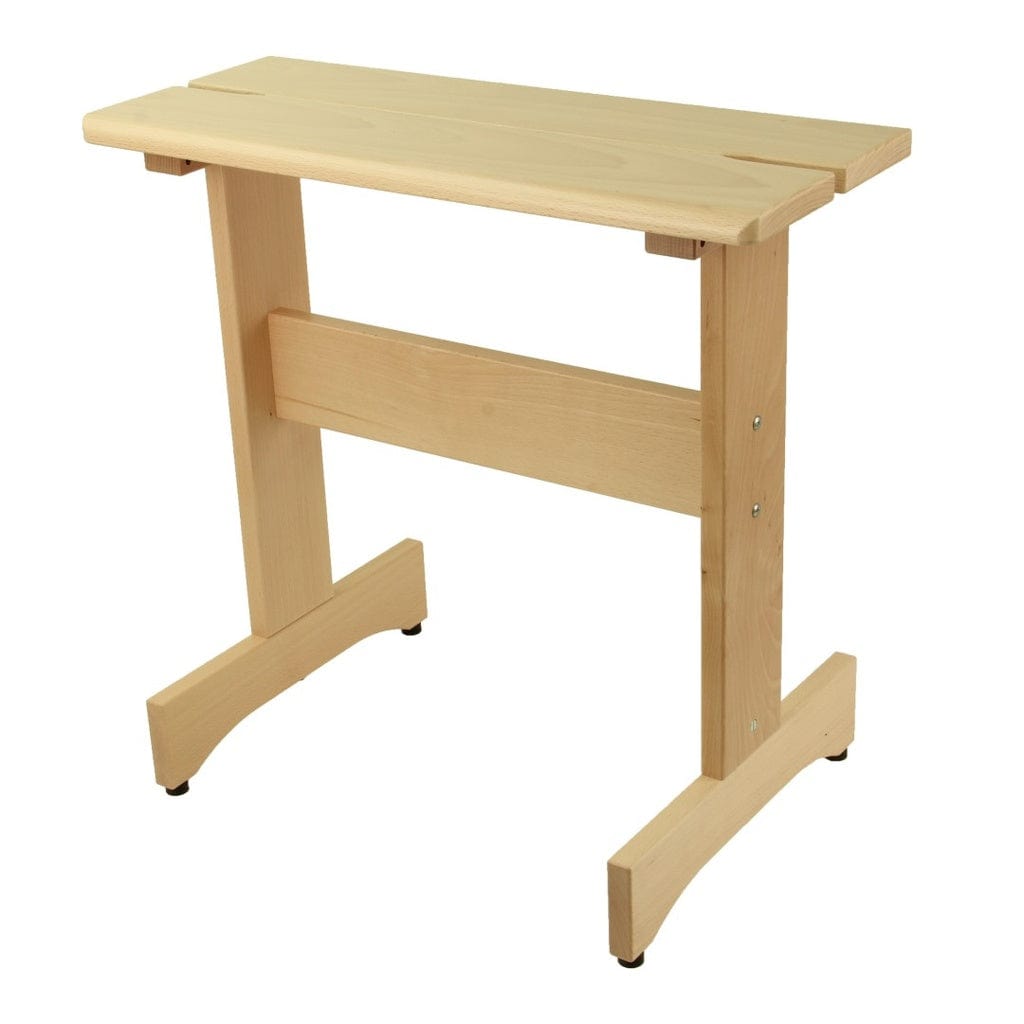 The Louet Inc. Louët Loom Benches are small, light hardwood benches with sturdy legs, a rectangular top featuring a slot near the edge, and a horizontal support beam—ideal for weaving next to your Louët loom.