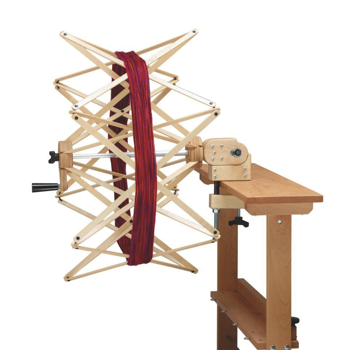 The Schacht Spindle Co. Ultra Umbrella Swift (currently out of stock with Schacht) easily clamps to a wooden table and is perfect for winding skeins into neat balls.