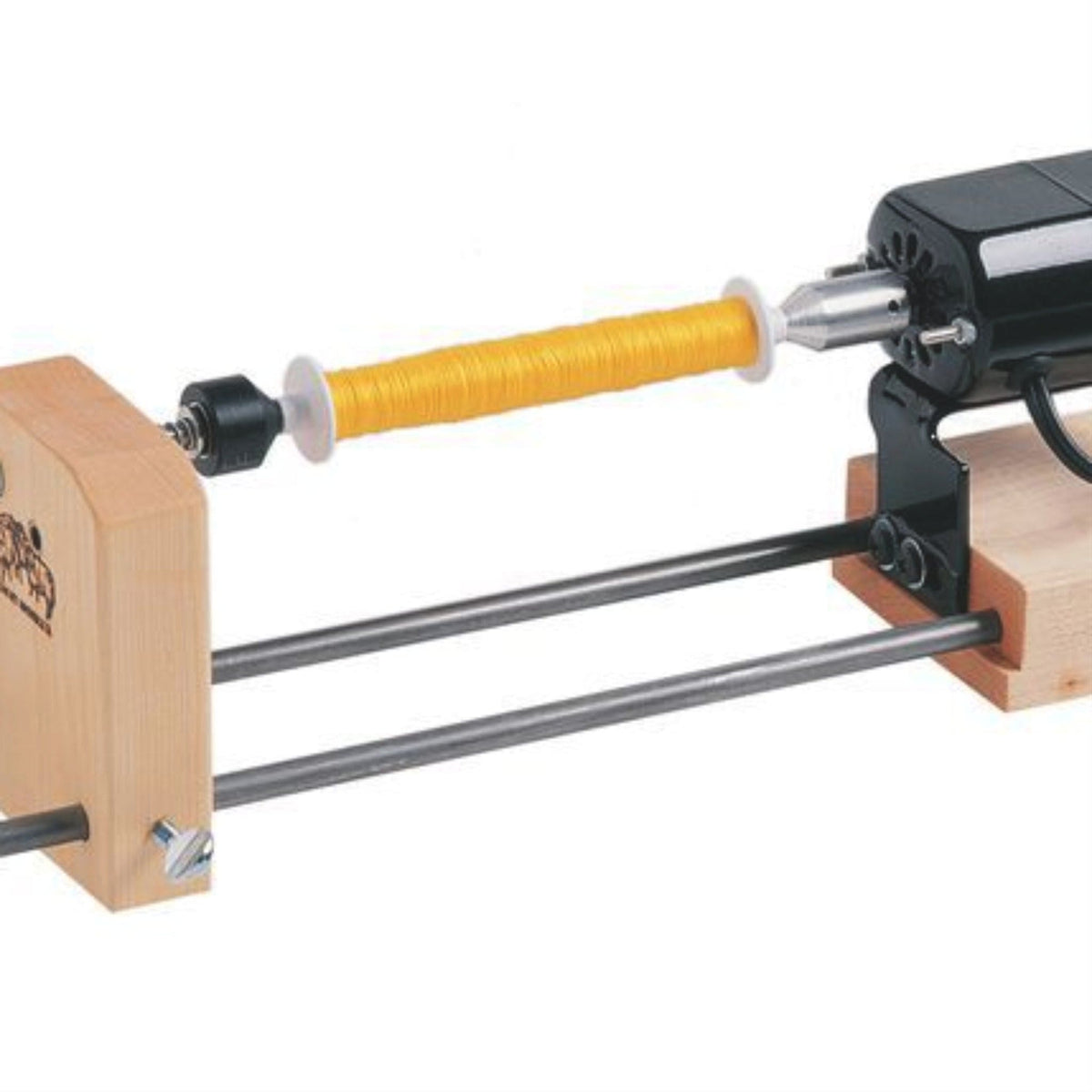 The Schacht Double-Ended Electric Winder by Schacht Spindle Co. is mounted on a wooden and metal frame with a black motor on one end and features a foot-controlled rheostat for precise speed regulation during use; currently, it is temporarily out of stock w/Schacht.