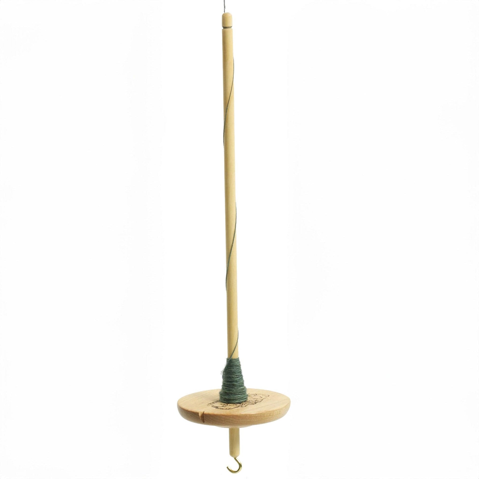 The Schacht Spindle Co. Schacht Hi-Lo Drop Spindle, with a round wooden whorl and metal hook at the bottom, is shown suspended vertically against a white background with green yarn wound around its shaft.