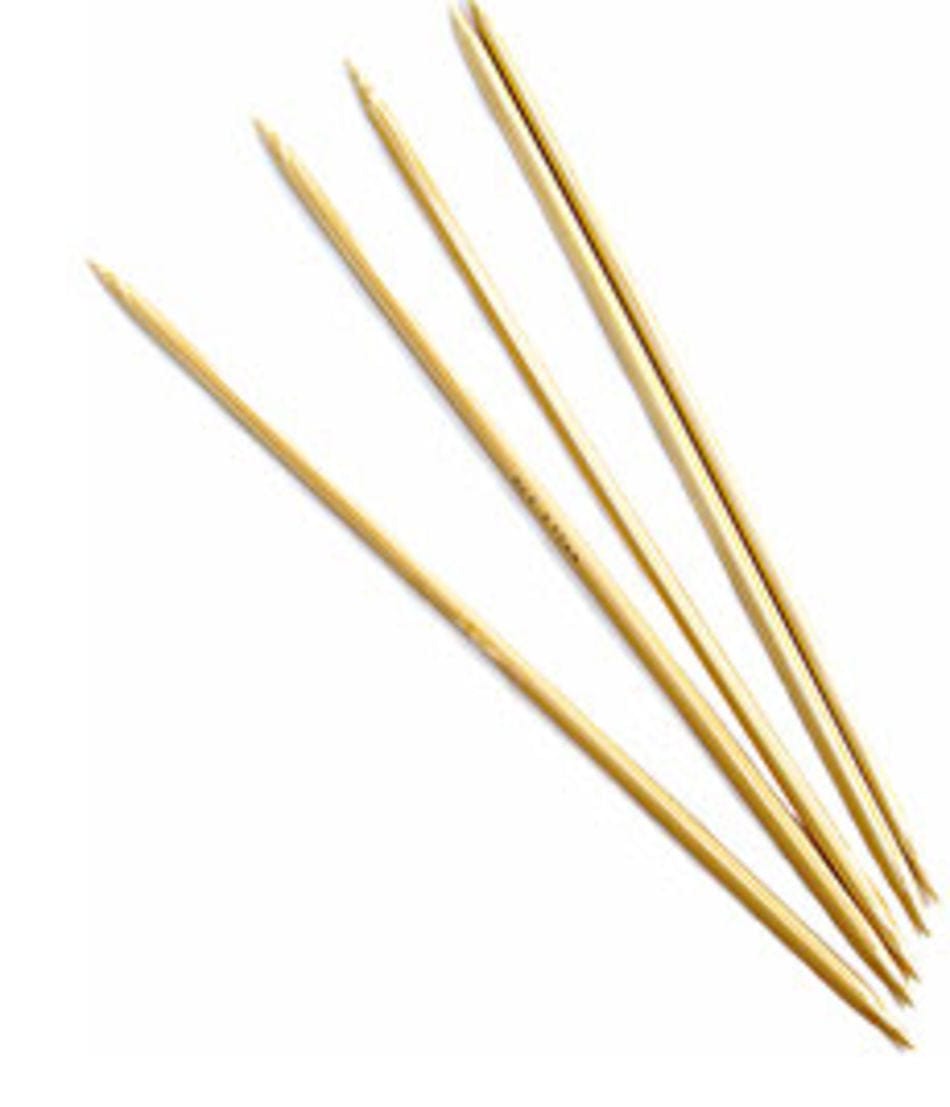 Five N. Jefferson Double-Point Bamboo Knitting Needles, 8", with a smooth polished finish, are arranged on a white background with their pointed ends facing different directions.