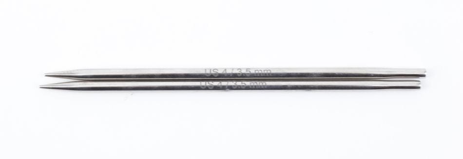 Two Knit Pro (Knitters Pride) Nova Metal Interchangeable Knitting Needles, 5", by Accessories Unlimited, are placed parallel on a white background. These silver needles feature pointed tips and size markings along the sides.