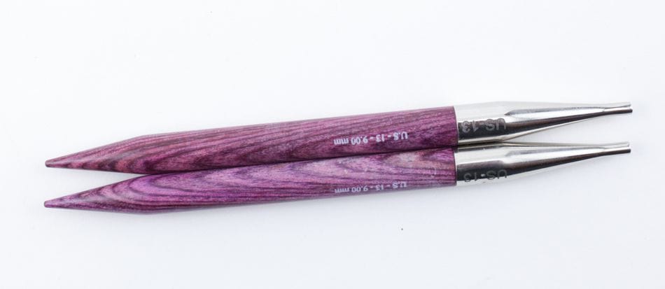 Two purple Accessories Unlimited Knit Pro (Knitters Pride) Dreamz Interchangeable Knitting Needle Tips made of laminated birch with silver connectors are displayed parallel on a white background, highlighting their quality design.
