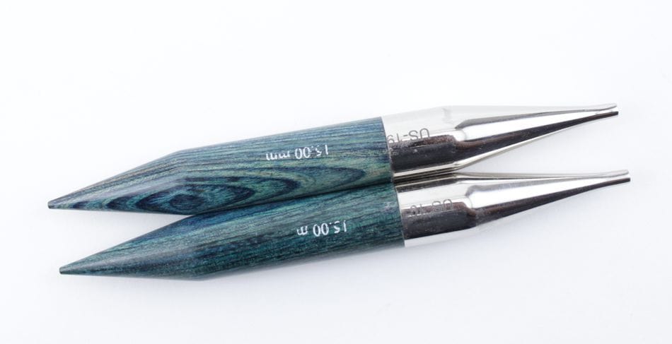 Two Accessories Unlimited Knit Pro Dreamz Interchangeable Knitting Needle Tips, made from laminated birch with greenish wood grain handles and silver connectors, are placed parallel on a white background.