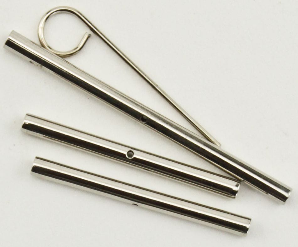 Four shiny metal Knit Pro (Knitters Pride) Cord Connectors by Accessories Unlimited and a hooked rod are arranged on a white background. The tubes have small holes, while the rod has a curved end for easy assembly.