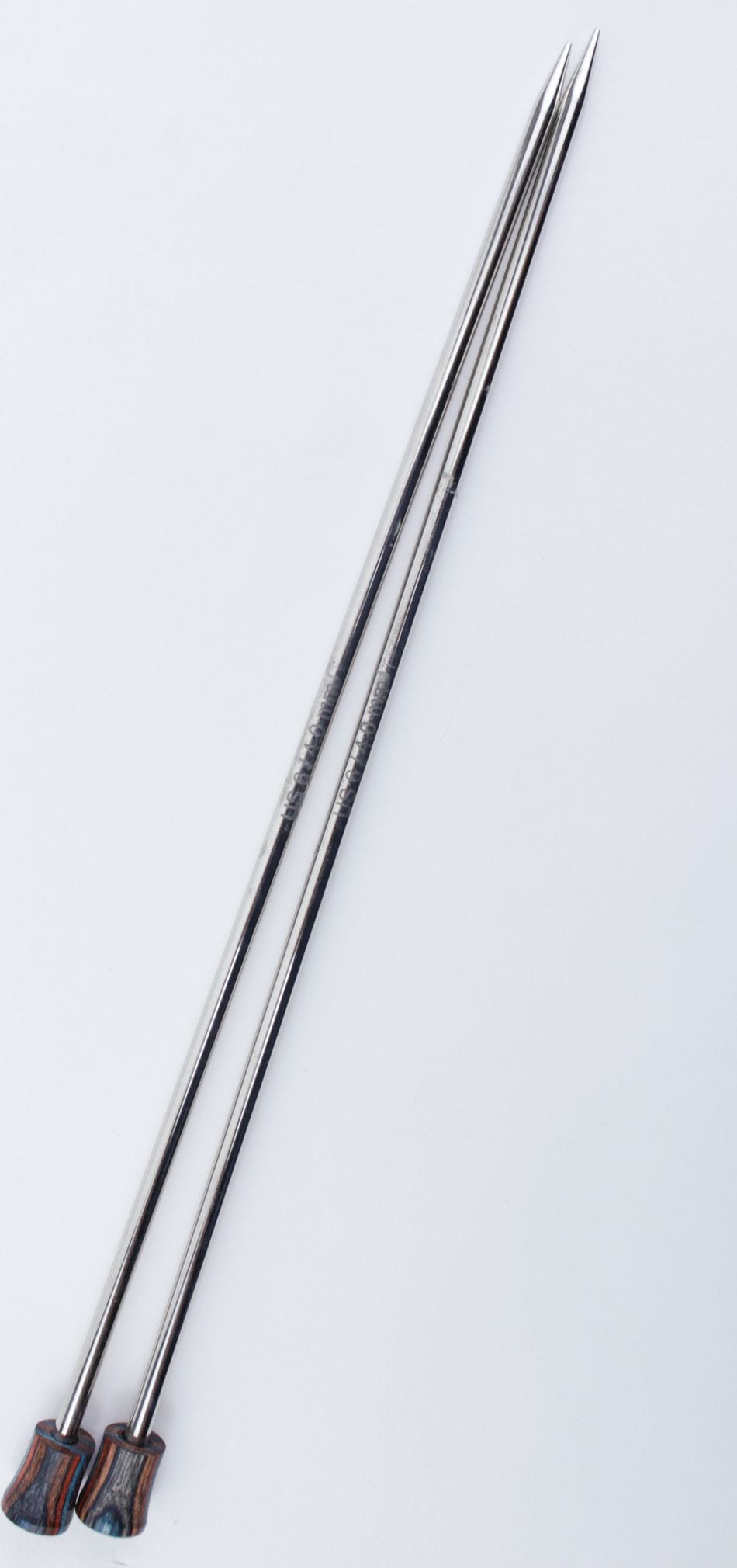 A pair of Accessories Unlimited Knit Pro Nova Metal Single Point Knitting Needles (10" or 14") with pointed tips are laid parallel on a white background.