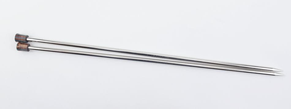 A pair of Accessories Unlimited Knit Pro Nova Metal Single Point Knitting Needles (10" or 14") with dark caps are lying parallel on a white surface.