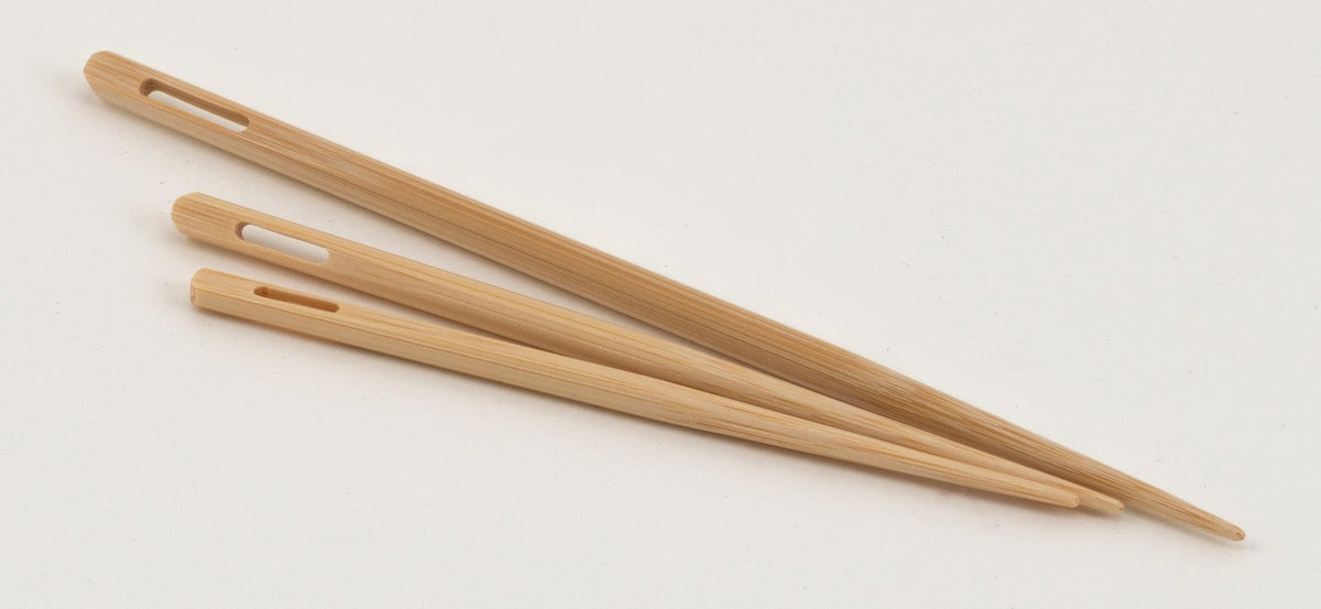 The N. Jefferson Jumbo Bamboo Blunt Needles (set of 3) are smooth, tapered needles with elongated eye holes, displayed on a plain white background and each needle varies slightly in length.