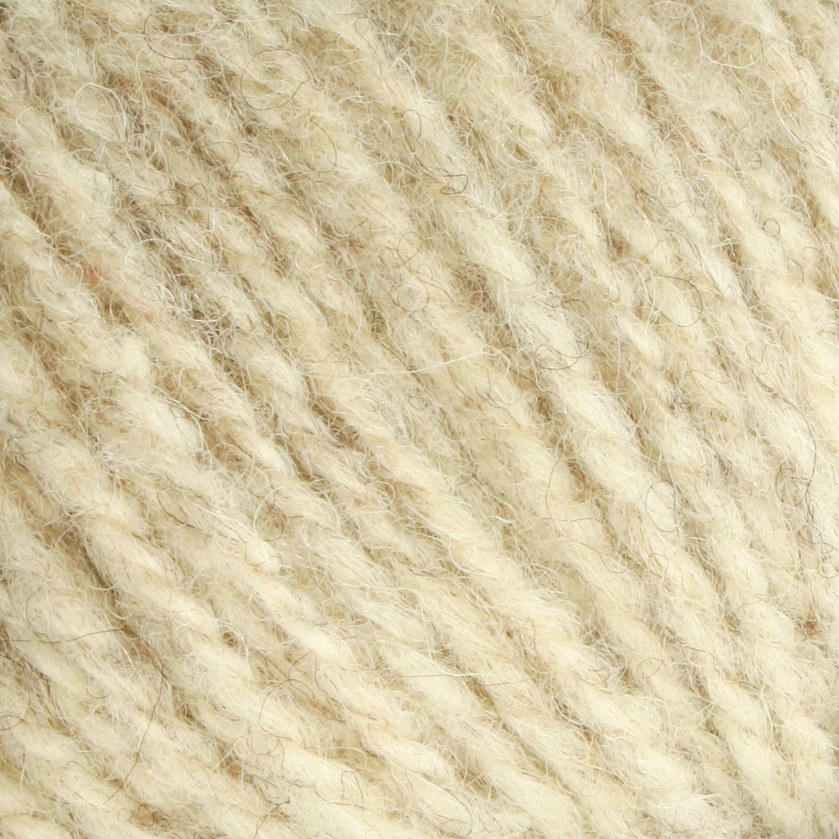 Close-up of Bartlettyarns Maine Wool Yarn (Fisherman 2-Ply) by Bartlettyarns in a cream hue, showing its soft, worsted weight fibers, twisted strands, and slightly fuzzy texture in detail.