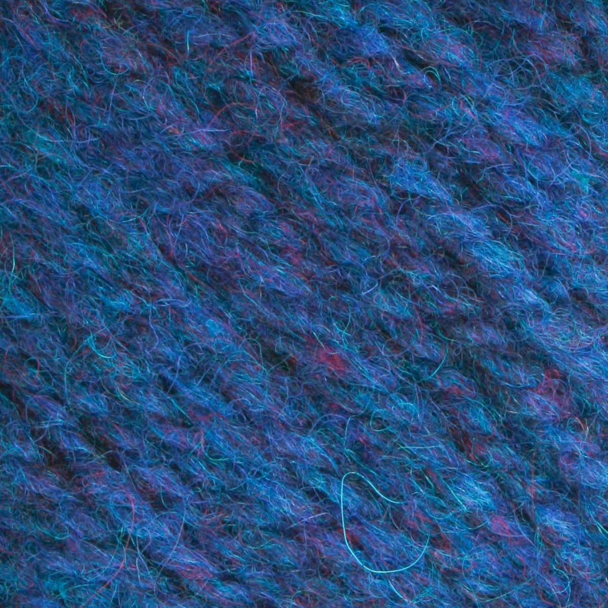 Close-up of Bartlettyarns Maine Wool Yarn (Fisherman 2-Ply), showcasing its blue and purple worsted weight fibers and strands woven together in a diagonal pattern.